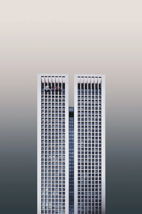 2 white tall buildings